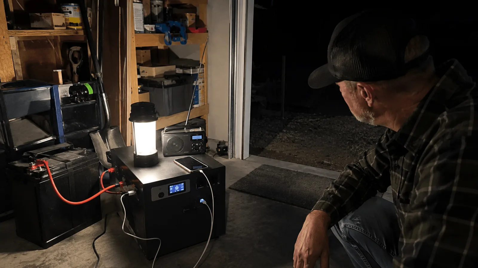 man working in dim workshop at night